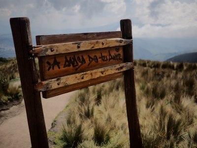 Photo of the back of a wooden sign